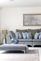 Grey ottoman in seating area