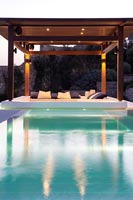 Luxury swimming pool  lit up at night