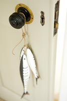 Fish ornament hanging from door knob