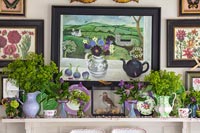 Floral and art display with vases  of Ladys Mantle flowers