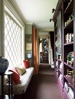Corridor with window seat and built in shelving