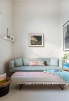 Grey sofa and pink ottoman