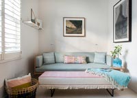 Grey sofa and pink ottoman