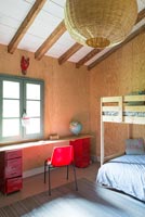 Childs bedroom with plywood walls