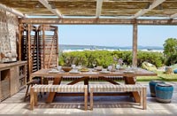 Outdoor dining area with sea views