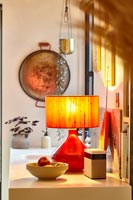 Orange lamp on kitchen counter