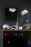 Accessories on chest of drawers