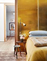 Gold wall in bedroom