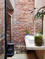 Bathroom with exposed brick wall