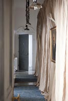 Corridor with curtains and rugs