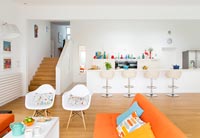 Colourful open plan seating area and kitchen