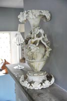 Ornate urn on mantlepiece