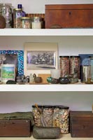 Collectibles on white shelves