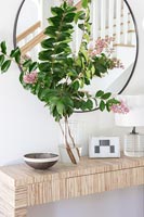 Vase of flowers on console table
