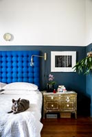 Bed with blue headboard