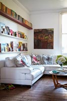 White corner sofa with colourful cushions