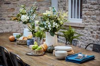 Flowers and crockery on dining table