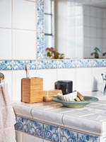 Toiletries on tiled washstand