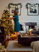 Claire Barnham decorating christmas tree