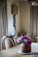 Vase of flowers on dining table