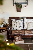 Leather sofa surrounded by christmas decorations