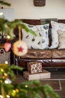Leather sofa surrounded by christmas decorations