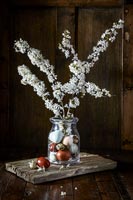 Jar of Blossom with birds eggs