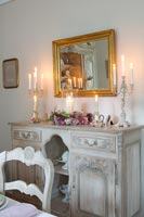 Candles on ornate sideboard