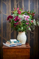 Flower arrangement in a vase on a bedside table