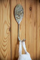 Detail of metal hook made from an old spoon