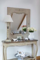 Mirror on sideboard with ornaments