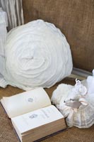Detail of white cushion and accessories