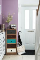 Colourful chest of drawers in hallway