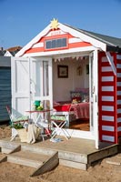 Beach hut with table and chairs