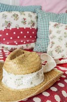 Detail of straw hat and cushions