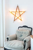Traditional armchair and contemporary wall light
