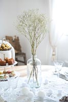 Dried flowers in glass vase on dining table
