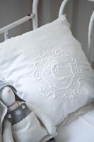 Embroidered cushion and soft toy