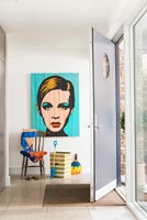 Colourful artwork in modern entrance hall
