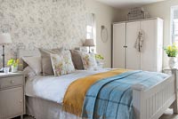 Country bedroom with colourful bedding