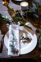 Place settings on a decorated wooden table