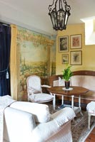 Detail of classic living room with painted wall mural