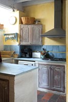 Detail of traditional style kitchen with modern hood
