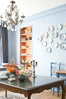 Classic dining room with wall display of plates