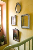 Classic wall mounted frames on stairway