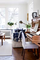 Piano and chair in classic living room
