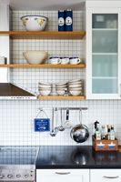 Shelves and utensils in classic country kitchen