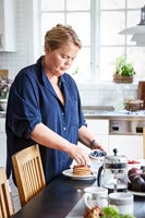 Woman preparing food in classic country kitchen