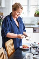 Woman preparing food in classic country kitchen