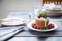 Pancakes on plate in classic country kitchen